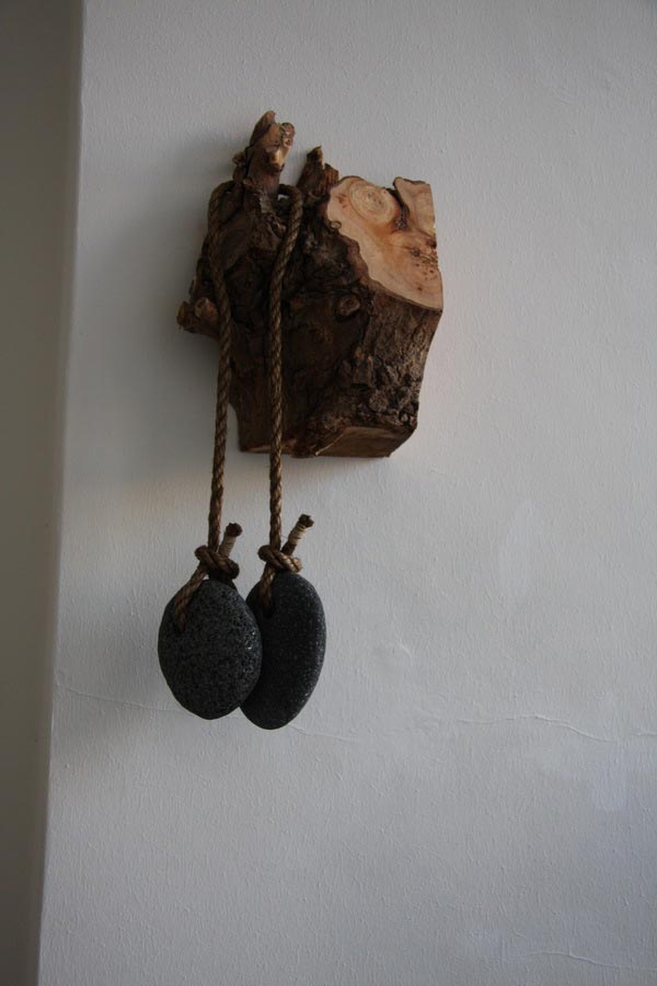 My old fame, 2011, wood, basalt lava, rope, 30 x 18 x 60 cm.